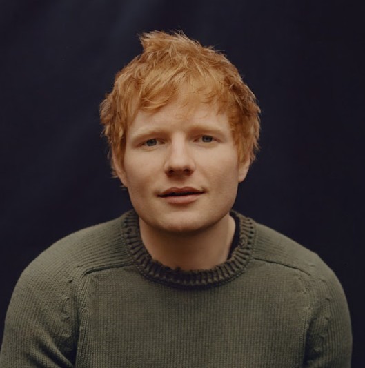 Ed Sheeran performing on stage (Source: YouTube)